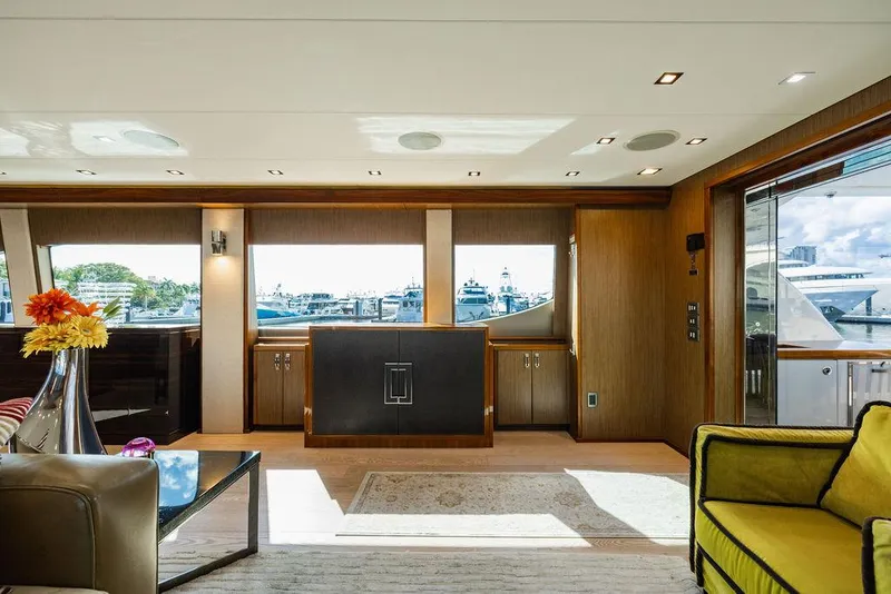 Slide: The Image of Luxurious interior of 2013 Hatteras 80 Motor Yacht with elegant furnishings and large windows. - 36