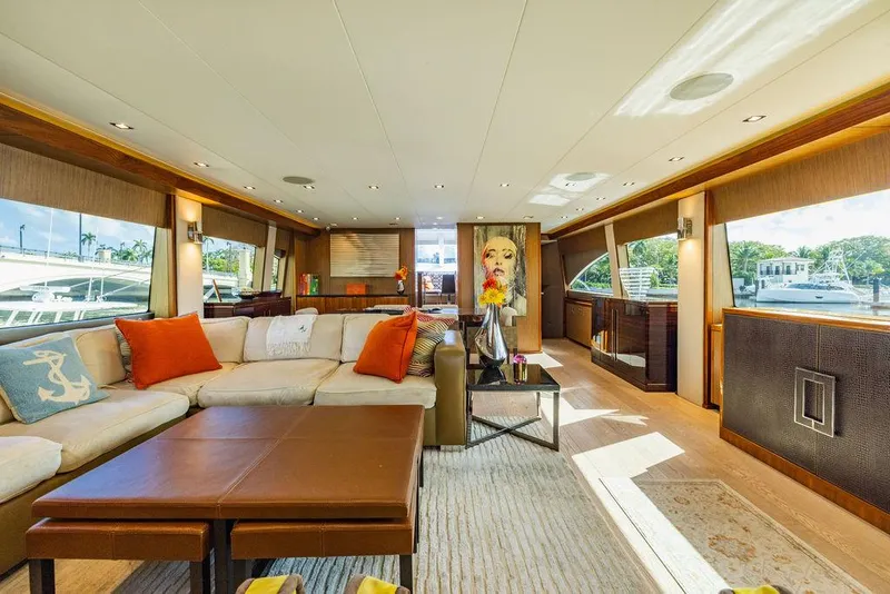 Slide: The Image of Luxurious interior of 2013 Hatteras 80 Motor Yacht with elegant furnishings and large windows. - 40