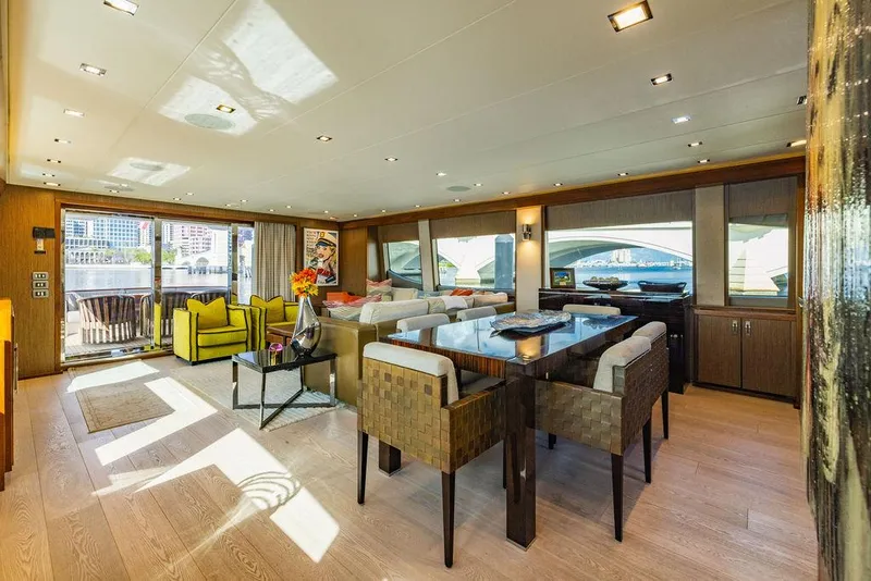 Slide: The Image of Luxurious interior of 2013 Hatteras 80 Motor Yacht with modern furnishings and large windows. - 41