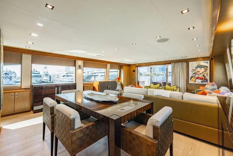 Slide: The Image of Luxurious interior of 2013 Hatteras 80 Motor Yacht with modern dining and seating area. - 46