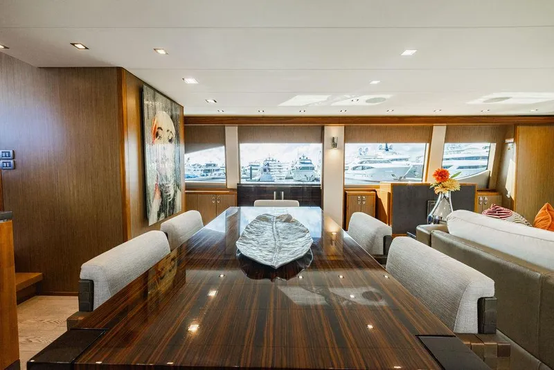 Slide: The Image of Luxurious interior of 2013 Hatteras 80 Motor Yacht with elegant dining area. - 48