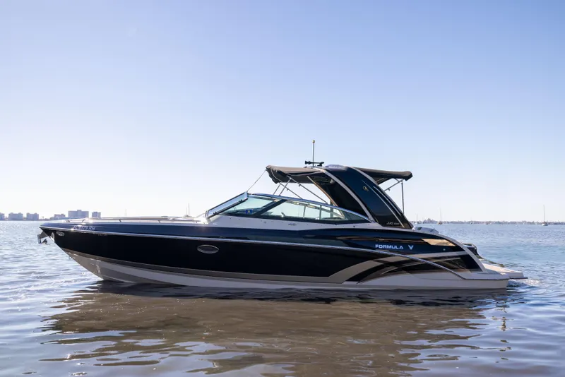 Slide: The Image of 2017 Formula 330 Crossover Bowrider on calm water, side view. - 0