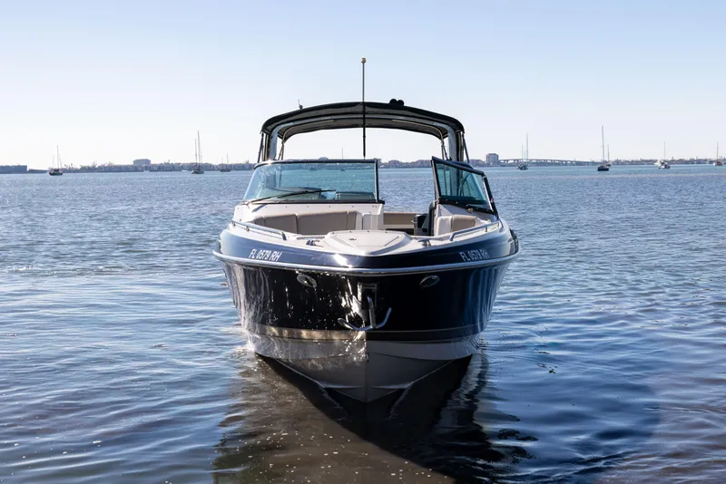 Slide: The Image of 2017 Formula 330 Crossover Bowrider on calm water, front view. - 1