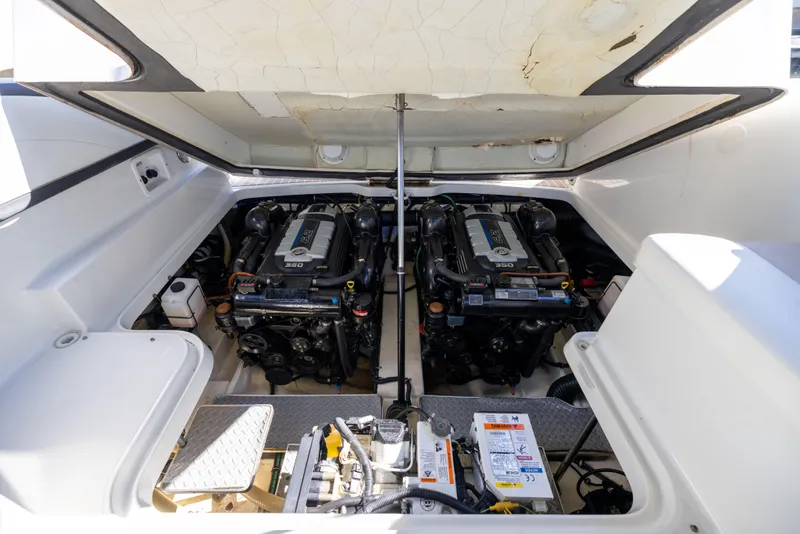 Slide: The Image of Engine compartment of a 2017 Formula 330 Crossover Bowrider, showcasing dual engines. - 11