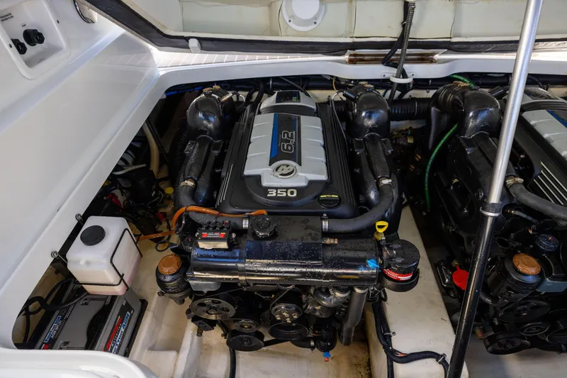 Slide: The Image of Engine compartment of a 2017 Formula 330 Crossover Bowrider, featuring a 350 horsepower engine. - 12
