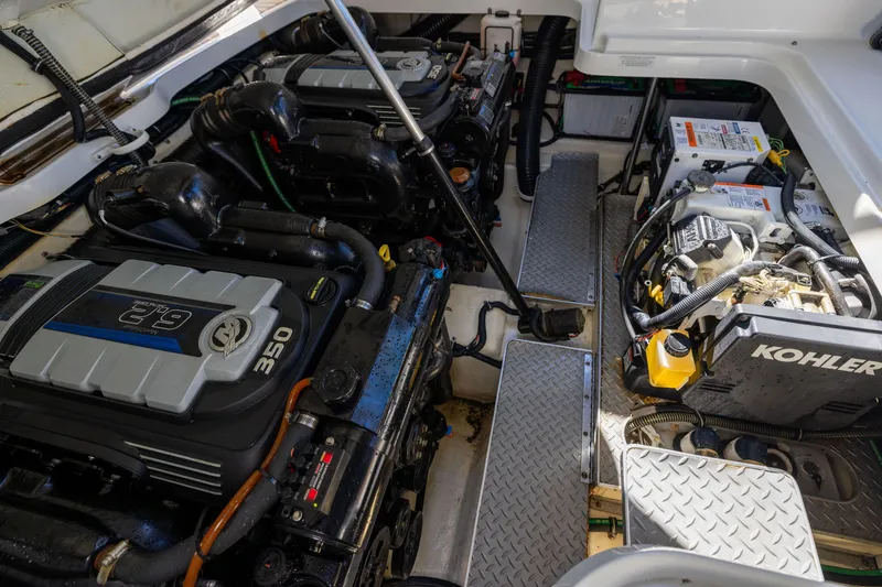 Slide: The Image of Engine compartment of 2017 Formula 330 Crossover Bowrider with dual engines and Kohler generator. - 14