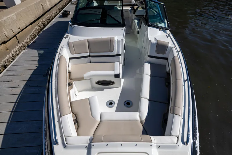 Slide: The Image of 2017 Formula 330 Crossover Bowrider docked, showcasing spacious seating and sleek design. - 32