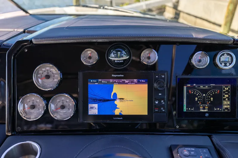 Slide: The Image of Dashboard of 2017 Formula 330 Crossover Bowrider with navigation and control displays. - 35