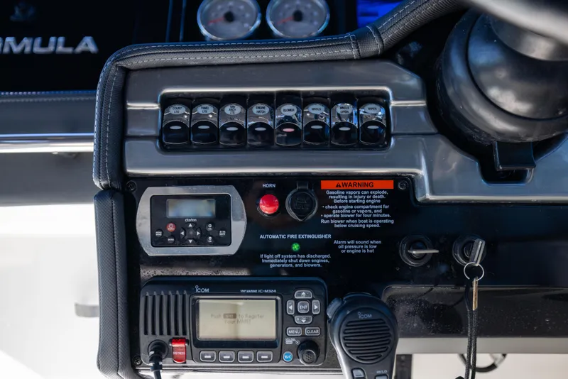 Slide: The Image of Control panel of 2017 Formula 330 Crossover Bowrider with switches and communication device. - 38