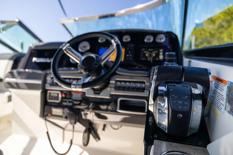 Slide: The Image of 2017 Formula 330 Crossover Bowrider dashboard with steering wheel and controls. - 39