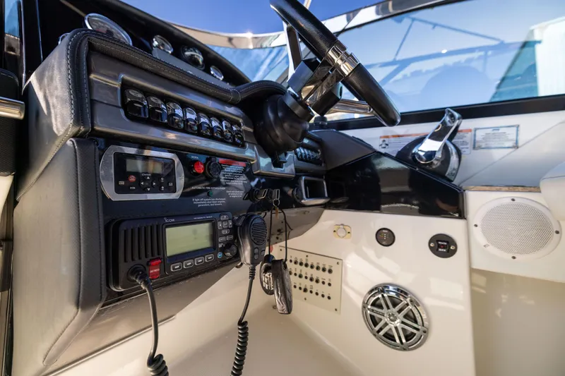 Slide: The Image of Control panel of 2017 Formula 330 Crossover Bowrider with steering wheel and radio equipment. - 40