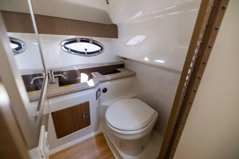 Slide: The Image of 2017 Formula 330 Crossover Bowrider bathroom interior with sink and toilet. - 43