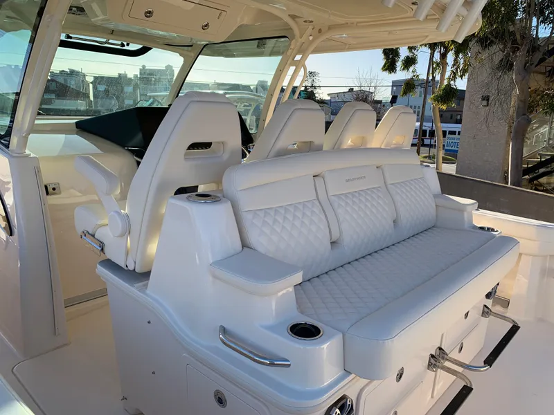 Slide: The Image of 2025 Grady-White Canyon 386 boat interior with luxurious seating and modern design. - 4