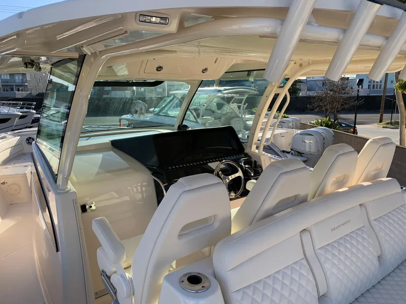 Slide: The Image of 2025 Grady-White Canyon 386 boat interior with modern helm and seating. - 5