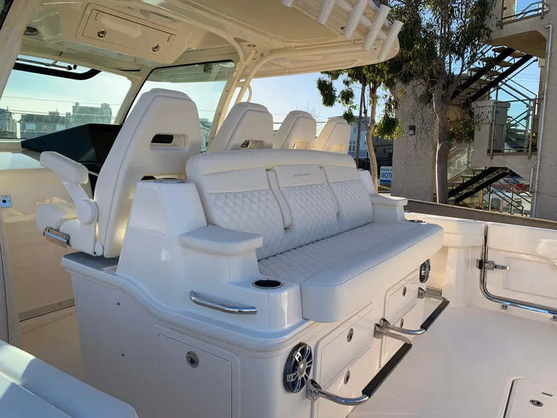 Slide: The Image of 2025 Grady-White Canyon 386 boat interior with luxurious seating and modern design. - 6