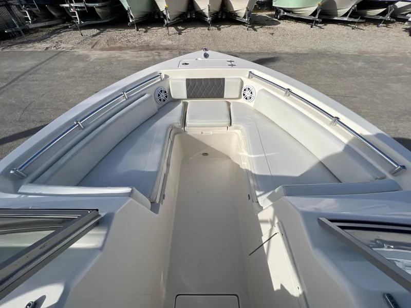 Slide: The Image of 2023 Cobia 220 Dual Console boat interior with spacious seating and sleek design. - 16