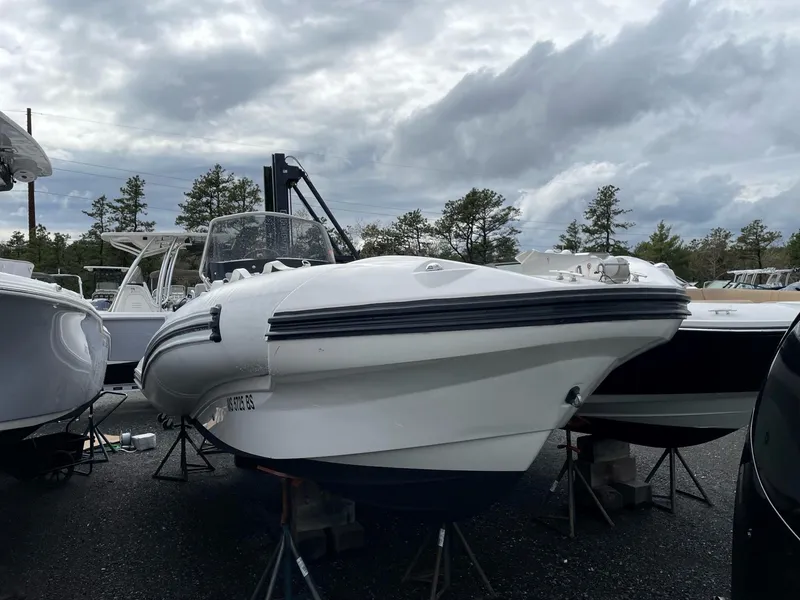 Slide: The Image of 2023 Zodiac N-ZO 680 boat on display under cloudy skies. - 2
