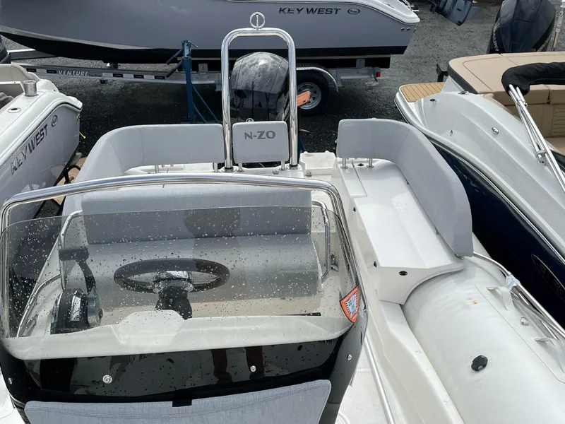 Slide: The Image of 2023 Zodiac N-ZO 680 boat interior with steering wheel and seating area. - 8
