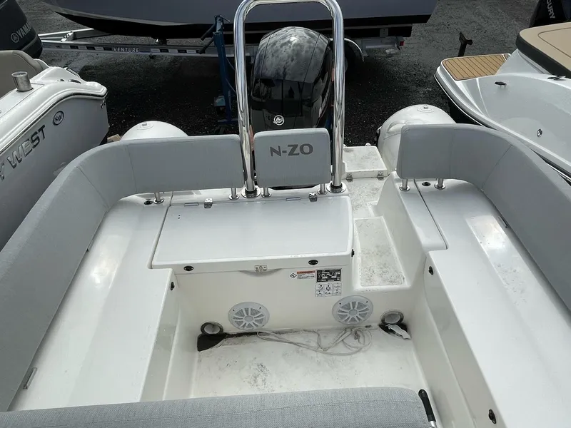 Slide: The Image of 2023 Zodiac N-ZO 680 boat interior with seating and storage area. - 9