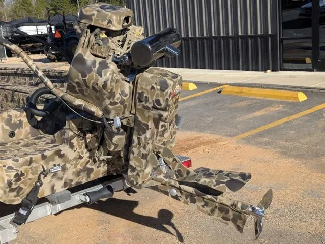 Slide: The Image of Camouflage-patterned Excel 1854 Shallow Water F4 boat, 2025 model, parked on a trailer. - 13