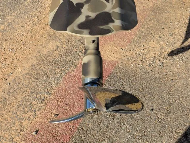 Slide: The Image of Propeller of Excel 1854 Shallow Water F4 boat, 2025 model, on textured ground. - 16