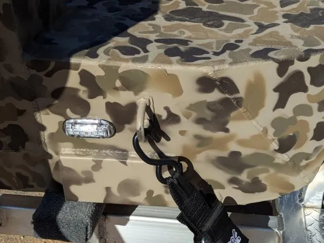 Slide: The Image of Camouflage-patterned Excel 1854 Shallow Water F4 boat detail, featuring a hook and light, 2025 model. - 19