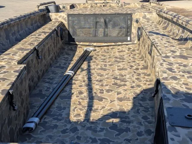 Slide: The Image of 2025 Excel 1854 Shallow Water F4 boat interior with camouflage design. - 27