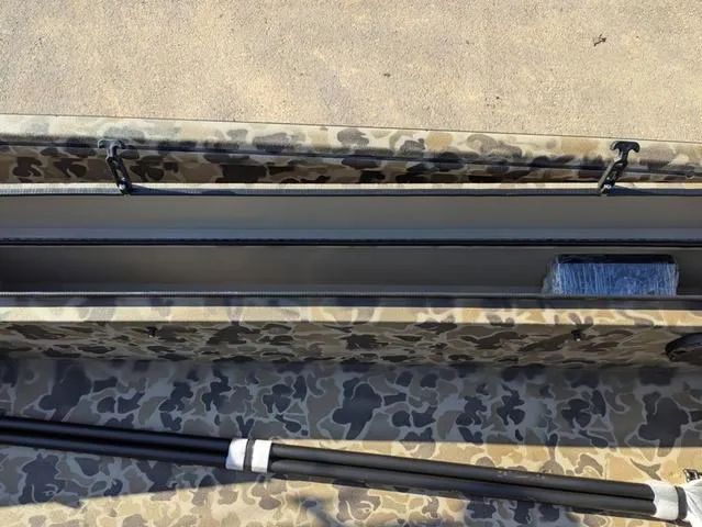 Slide: The Image of 2025 Excel 1854 Shallow Water F4 boat interior with camouflage design and storage compartment. - 38