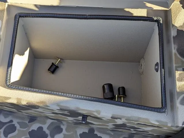 Slide: The Image of Storage compartment of 2025 Excel 1854 Shallow Water F4 boat with camo pattern. - 39
