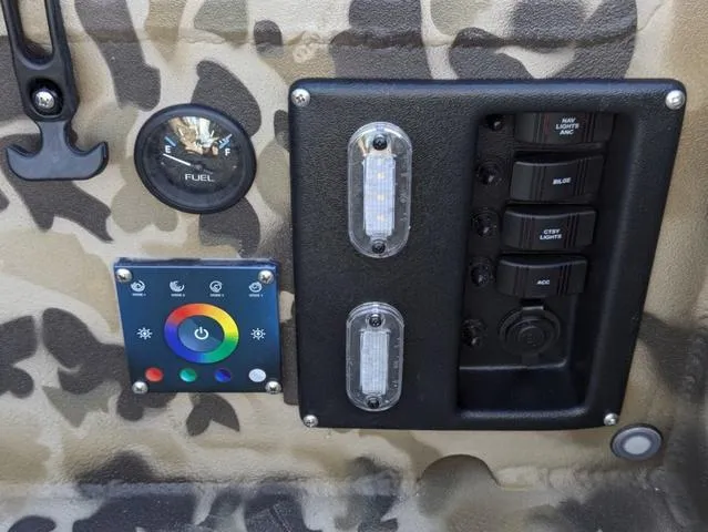 Slide: The Image of Control panel of 2025 Excel 1854 Shallow Water F4 boat with camouflage design. - 43