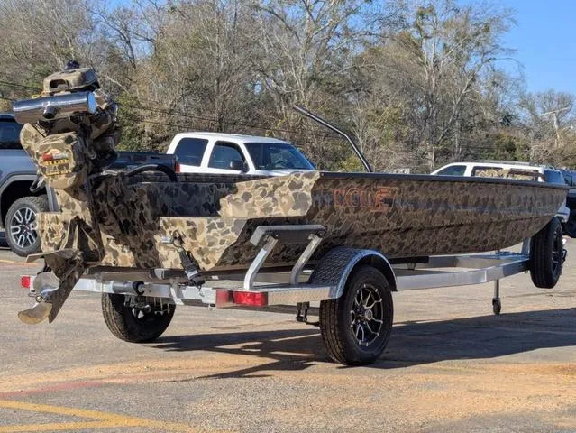 Slide: The Image of 2025 Excel 1854 Shallow Water F4 boat with camouflage design on a trailer. - 6