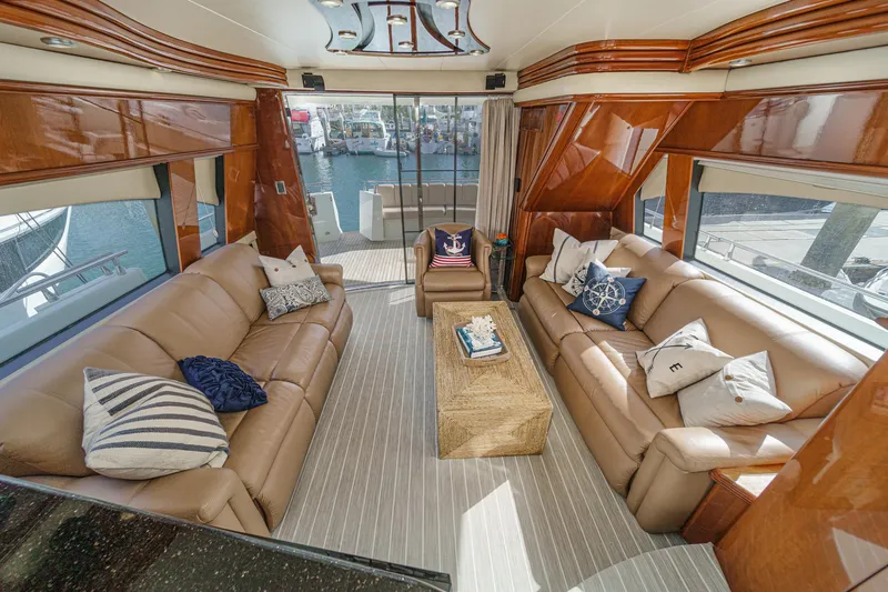 Slide: The Image of Luxurious interior of a 2004 Marquis 59 yacht with plush seating and elegant decor. - 12