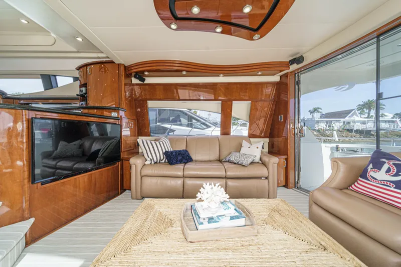 Slide: The Image of Luxurious interior of a 2004 Marquis 59 yacht with elegant seating and decor. - 14