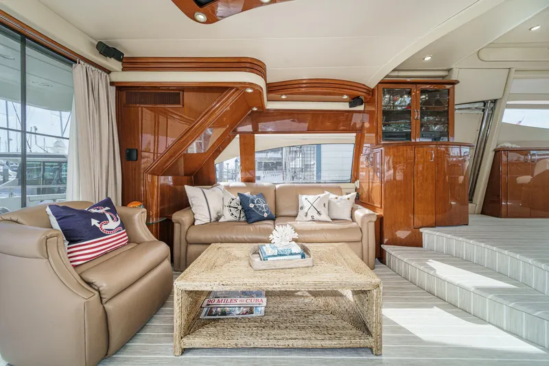 Slide: The Image of Luxurious interior of a 2004 Marquis 59 yacht with elegant seating and nautical decor. - 15
