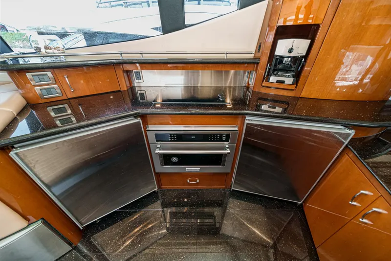 Slide: The Image of Luxurious kitchen interior of a 2004 Marquis 59 yacht with modern appliances. - 18
