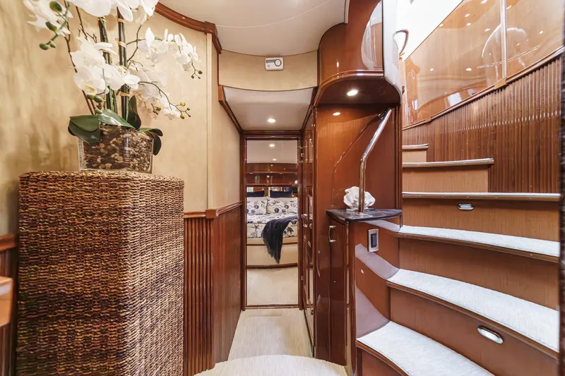 Slide: The Image of Luxurious interior of a 2004 Marquis 59 yacht with elegant wooden staircase. - 22