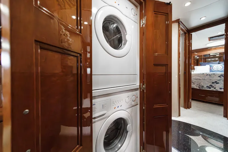 Slide: The Image of Laundry area in 2004 Marquis 59 yacht with stacked washer and dryer. - 26