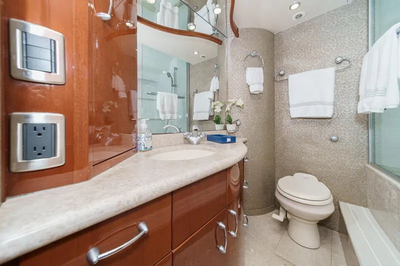 Slide: The Image of Luxurious bathroom in a 2004 Marquis 59 yacht with elegant fixtures and decor. - 28