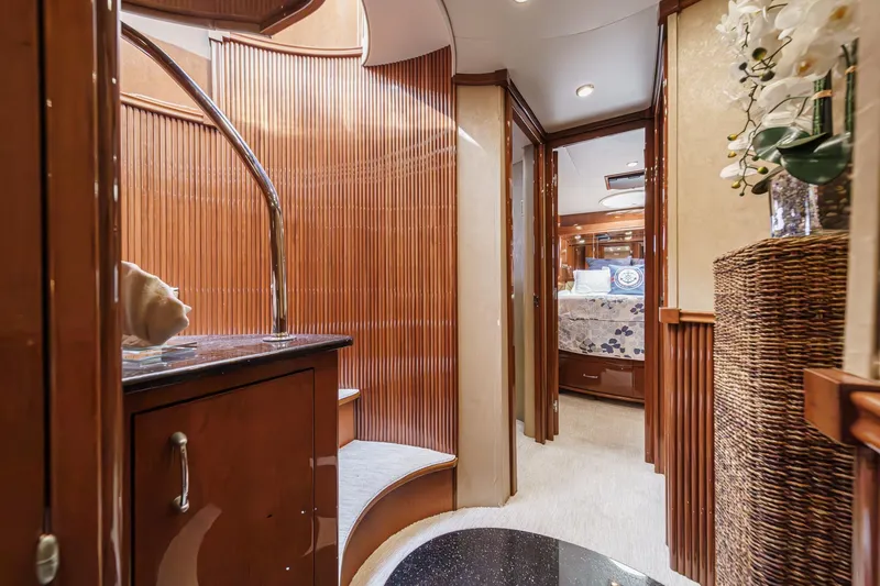 Slide: The Image of Luxurious interior of a 2004 Marquis 59 yacht with elegant wood paneling and modern decor. - 31