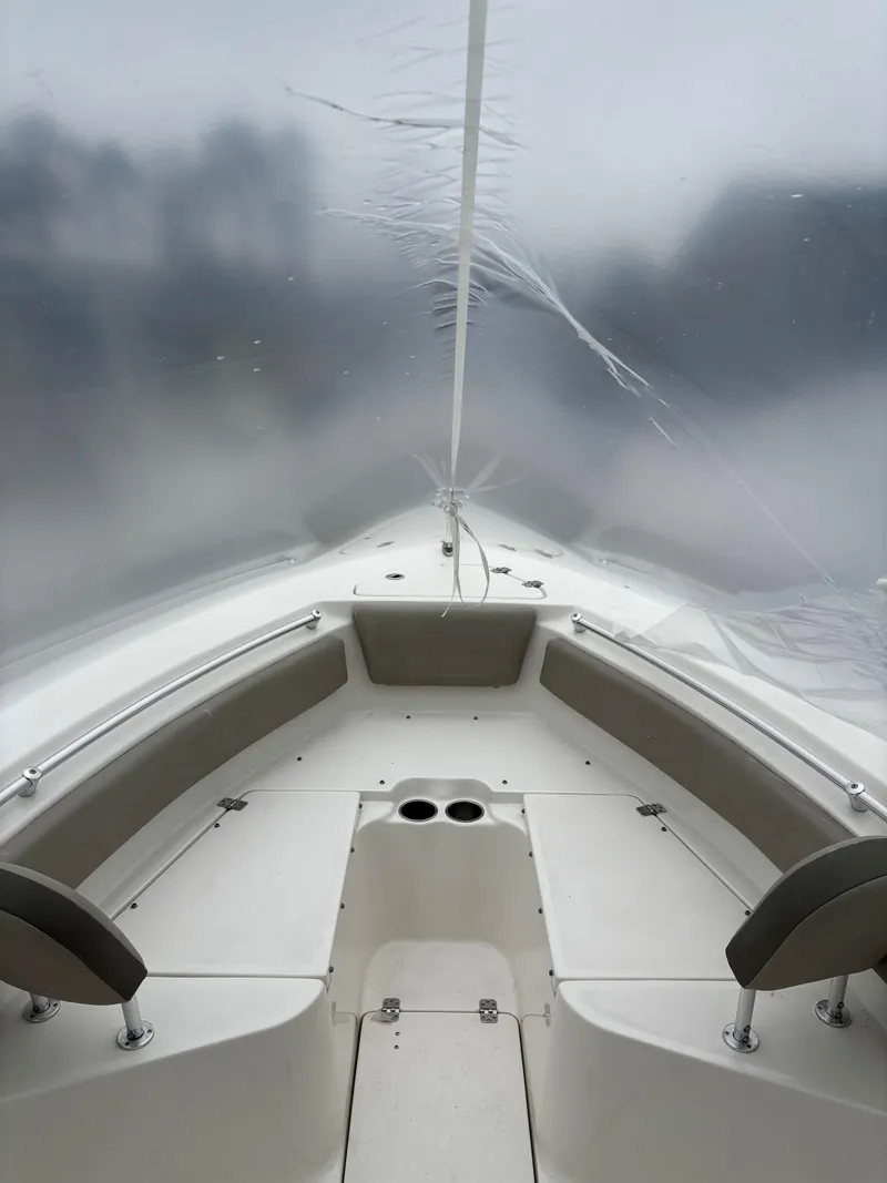 Slide: The Image of Interior view of 2023 Key West 239 FS boat with seating and cup holders. - 6