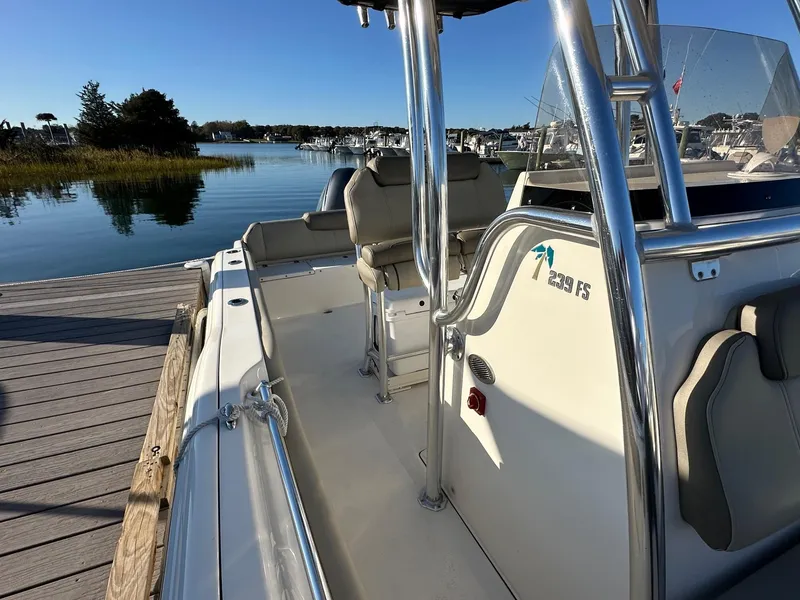 Slide: The Image of 2023 Key West 239 FS boat docked by serene waters under clear blue sky. - 3