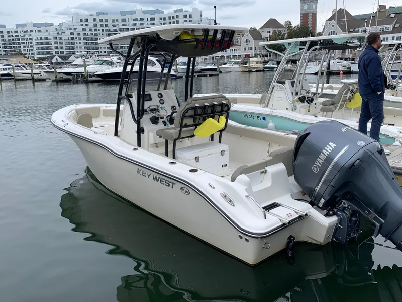 Slide: The Image of 2024 Key West 239 FS boat docked with Yamaha engine. - 1