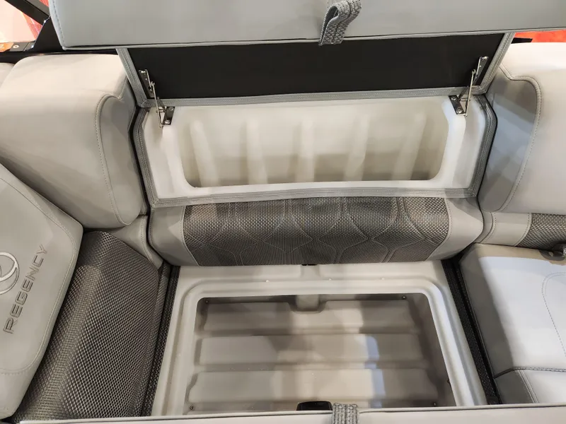 Slide: The Image of Interior storage compartment of 2025 Regency 250 LE3 boat, featuring spacious seating. - 10