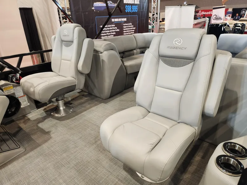 Slide: The Image of Luxurious seating in 2025 Regency 250 LE3 boat, featuring plush gray upholstery. - 7