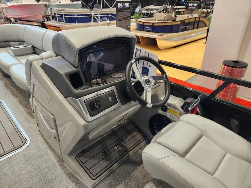Slide: The Image of 2025 Regency 250 LE3 boat interior with modern helm and comfortable seating. - 8