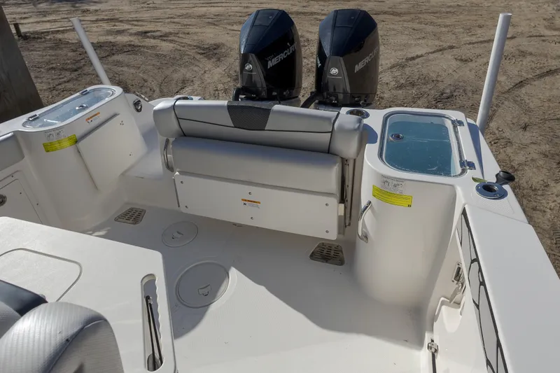 Slide: The Image of 2019 Wellcraft 262 Fisherman boat interior with dual Mercury engines. - 10