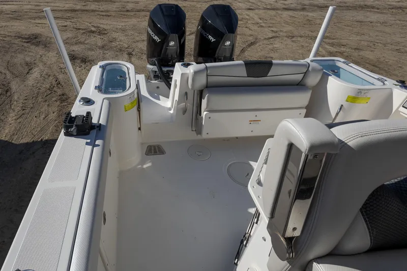 Slide: The Image of 2019 Wellcraft 262 Fisherman boat interior with dual Mercury engines. - 11