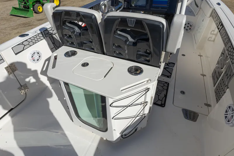 Slide: The Image of 2019 Wellcraft 262 Fisherman boat interior with seating and storage features. - 12