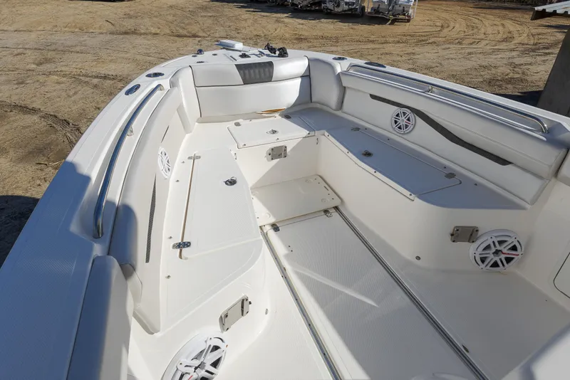 Slide: The Image of 2019 Wellcraft 262 Fisherman boat interior with seating and storage compartments. - 13