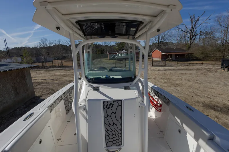 Slide: The Image of 2019 Wellcraft 262 Fisherman boat, center console view, parked outdoors. - 14